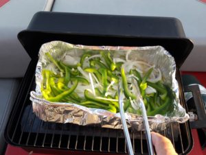 Peppers and onions on the grill